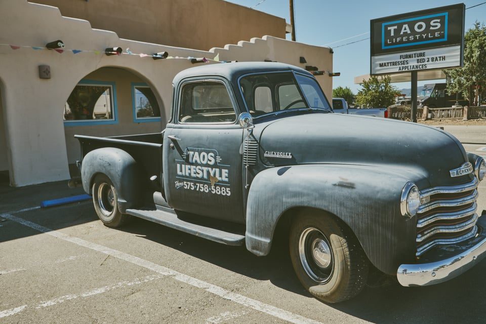 The vintage Taos Lifestyle truck parked outside the store