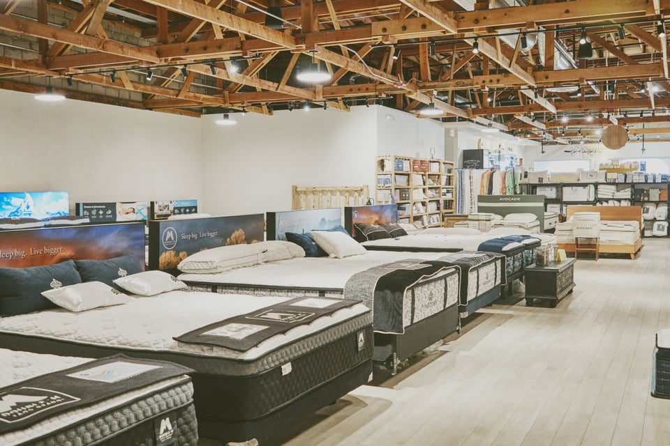 Mattress showroom with rows of beds