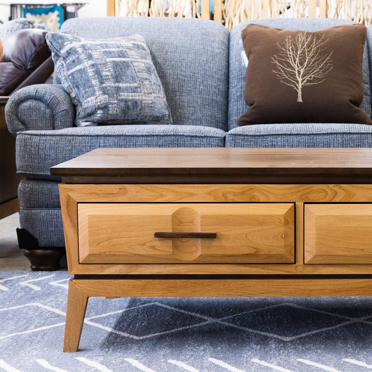 Blue sectional sofa and wood console