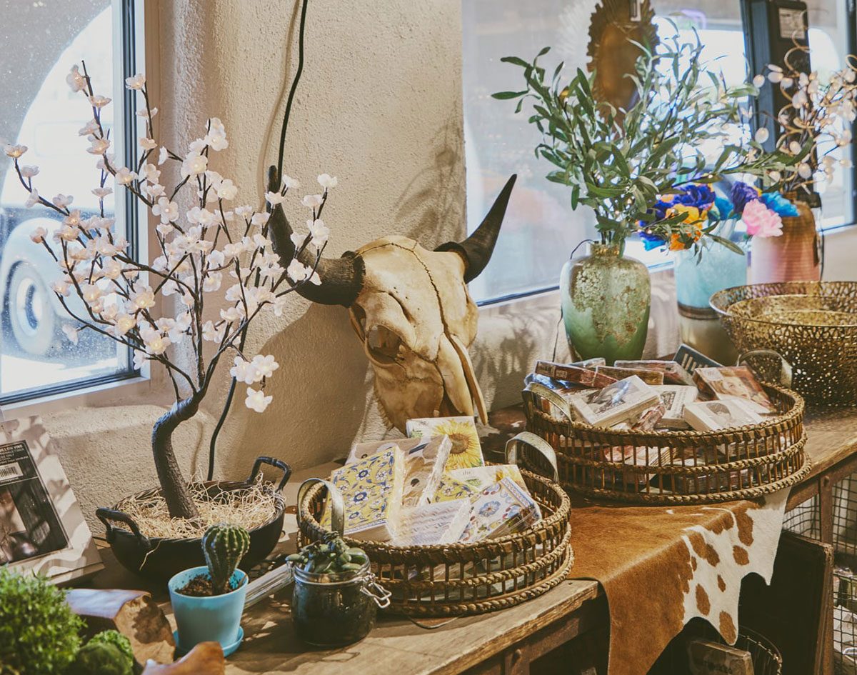 Gift shop counter with cards, baskets, and gifts